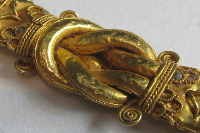 An elaborate gold belt buckle