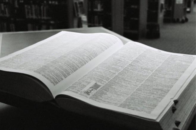 Photograph of an open dictionary on a table